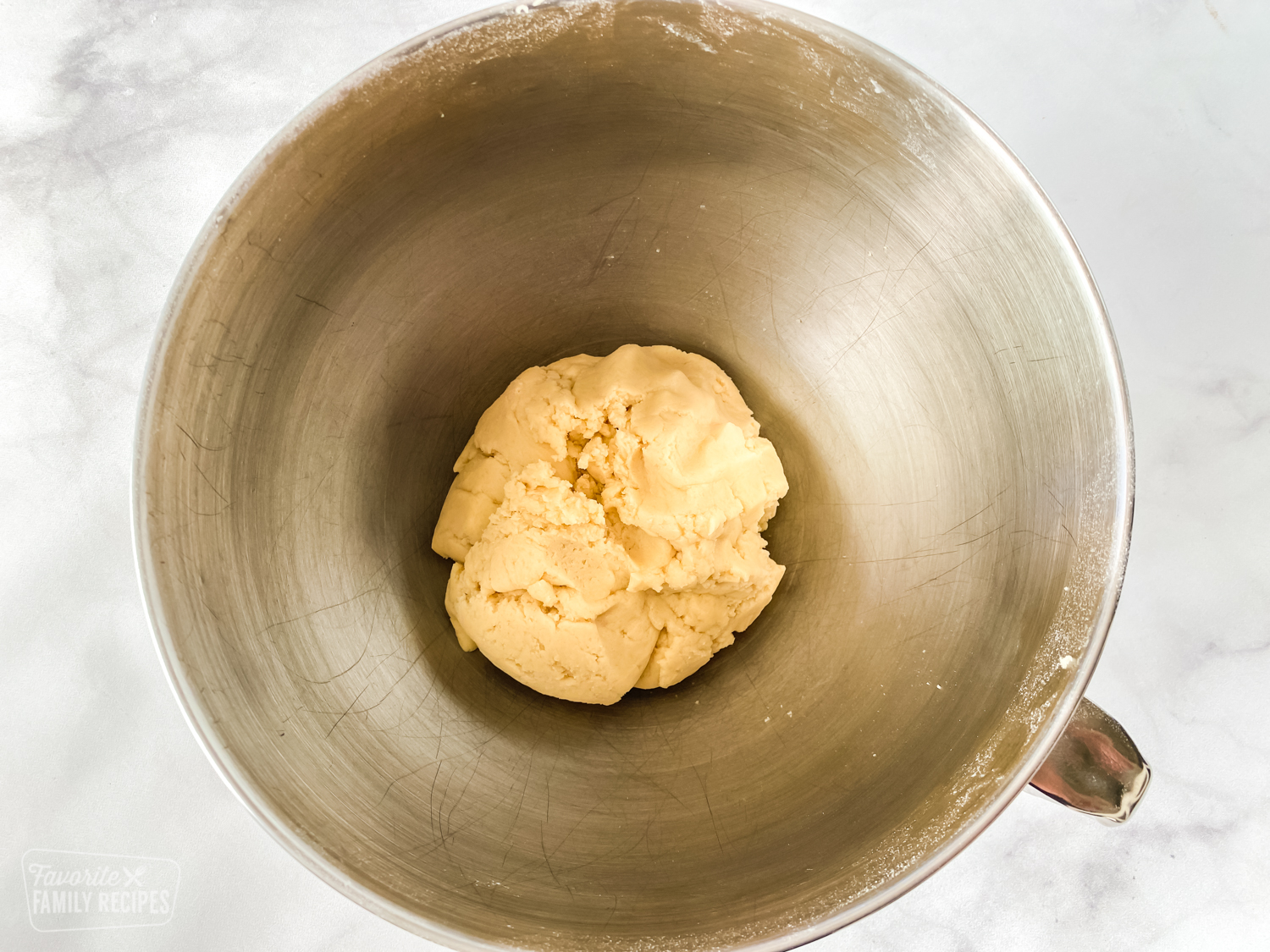 Sugar cookie dough ball in a bowl