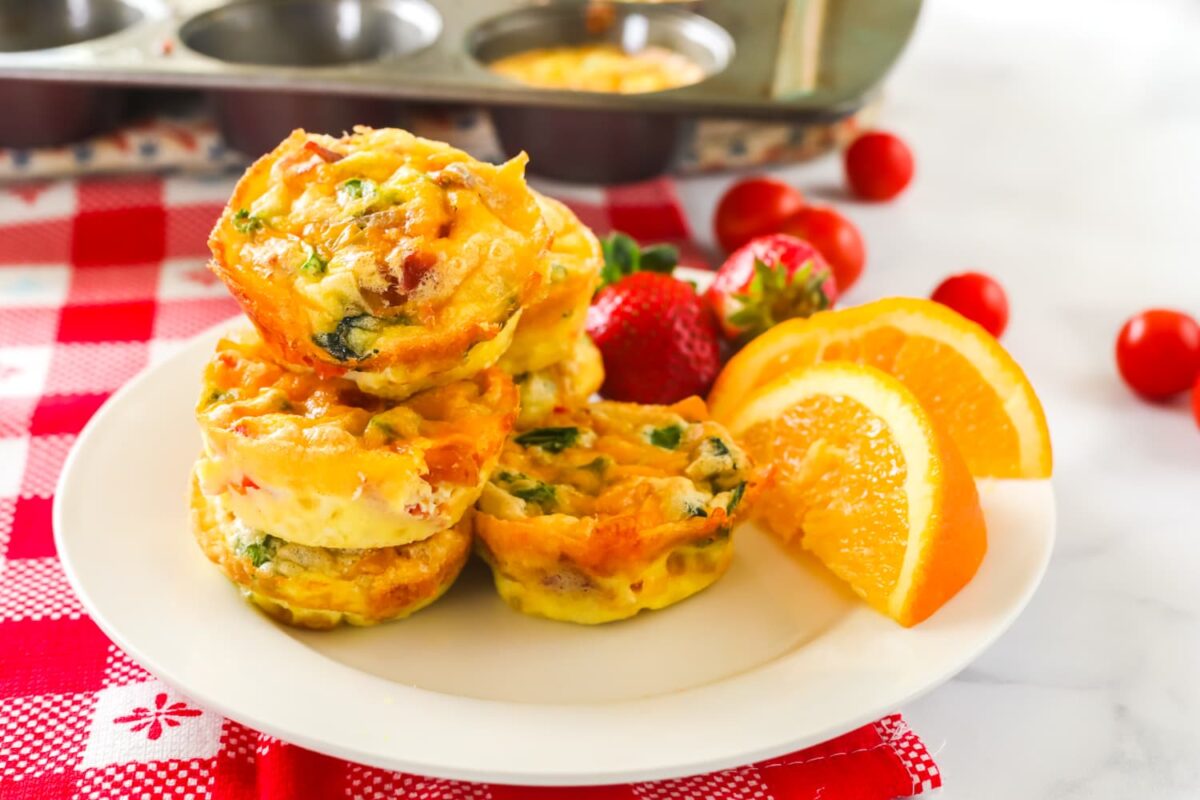 Egg muffins on a plate with fruit