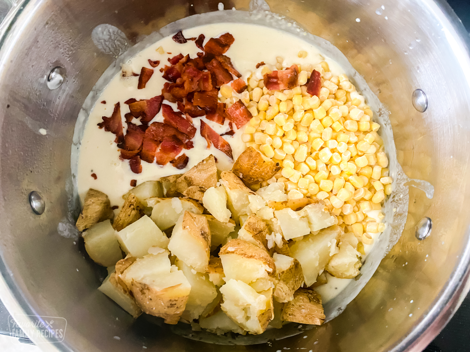 Potatoes, bacon and corn in a pot