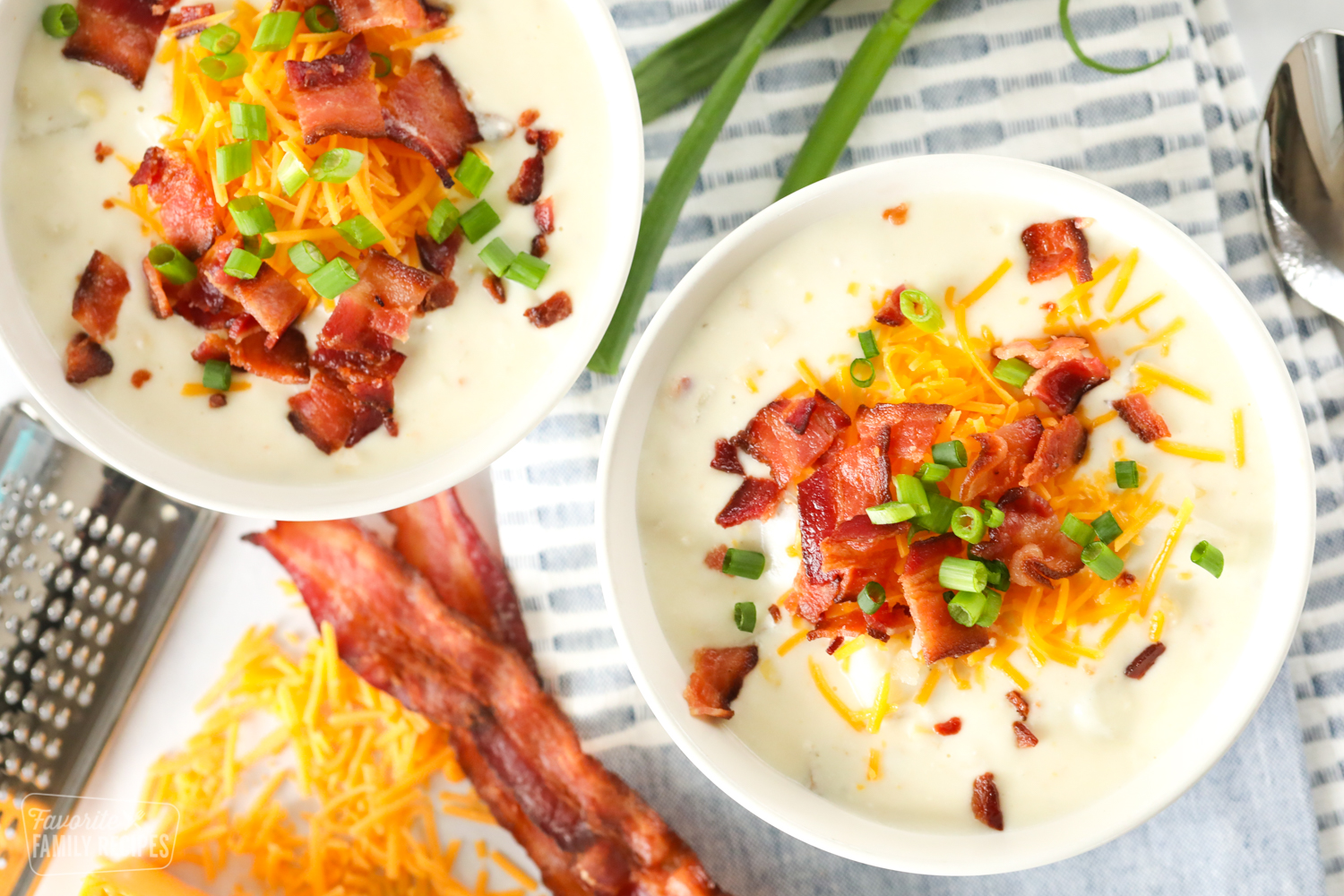 Two bowls of baked potato soup 