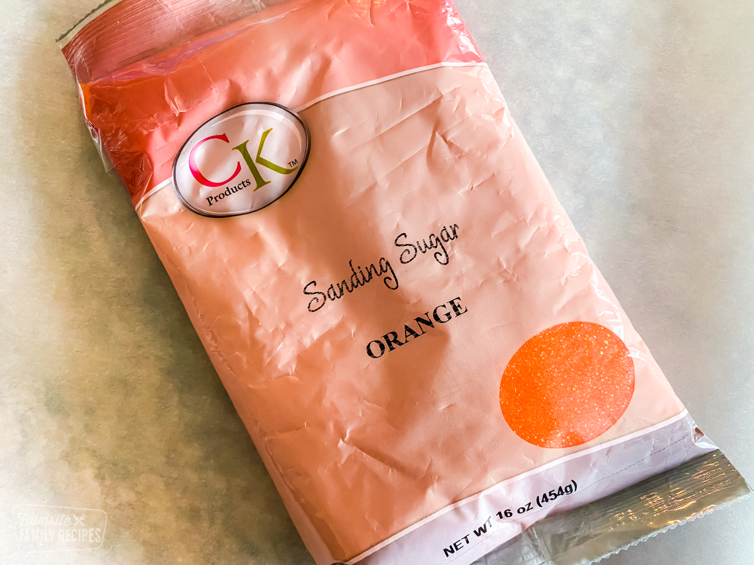 Bag of orange sanding sugar