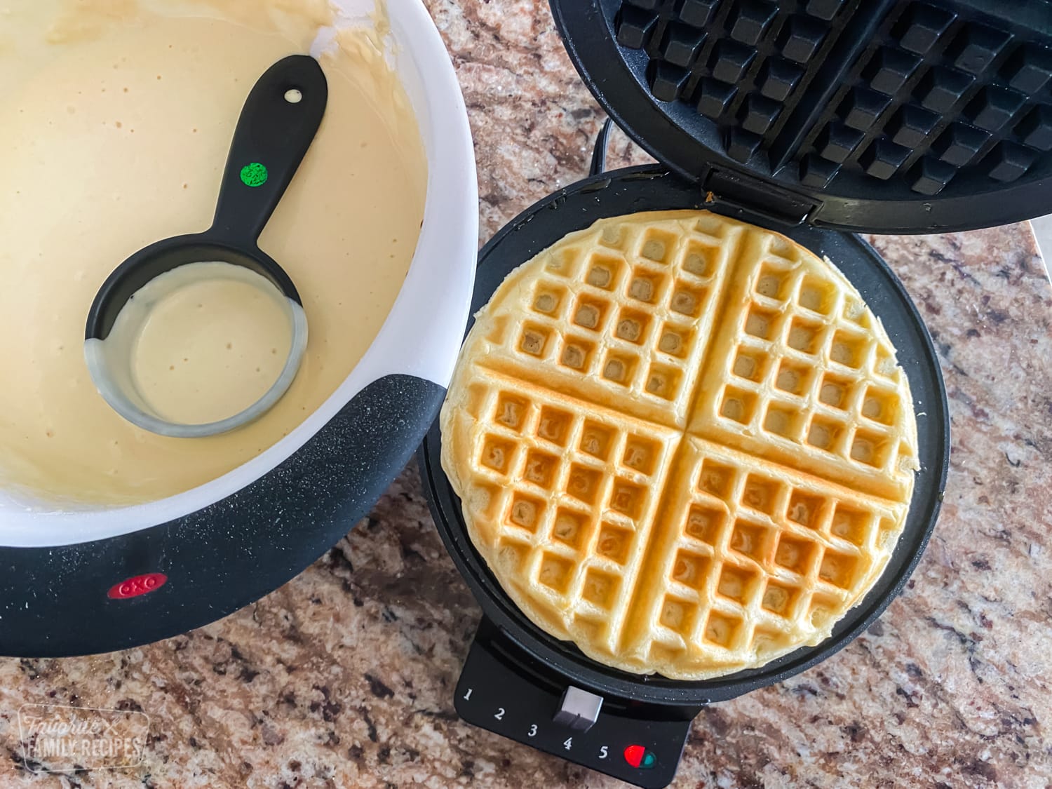 Waffle being cooked in a waffle iron
