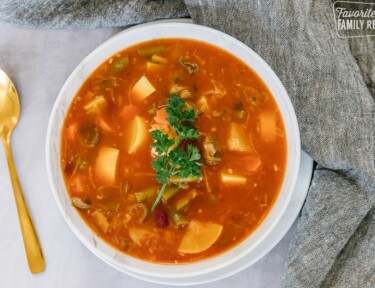 A bowl of Weight loss magic soup with vegetables and parsley