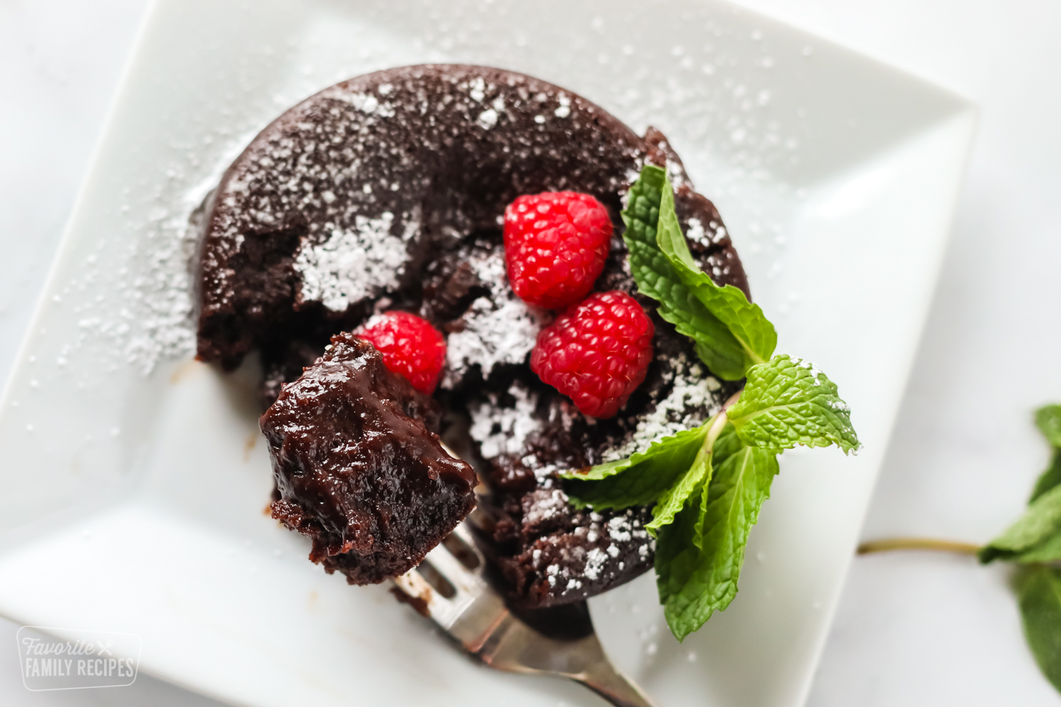 Lava cake on a fork showing moist texture.