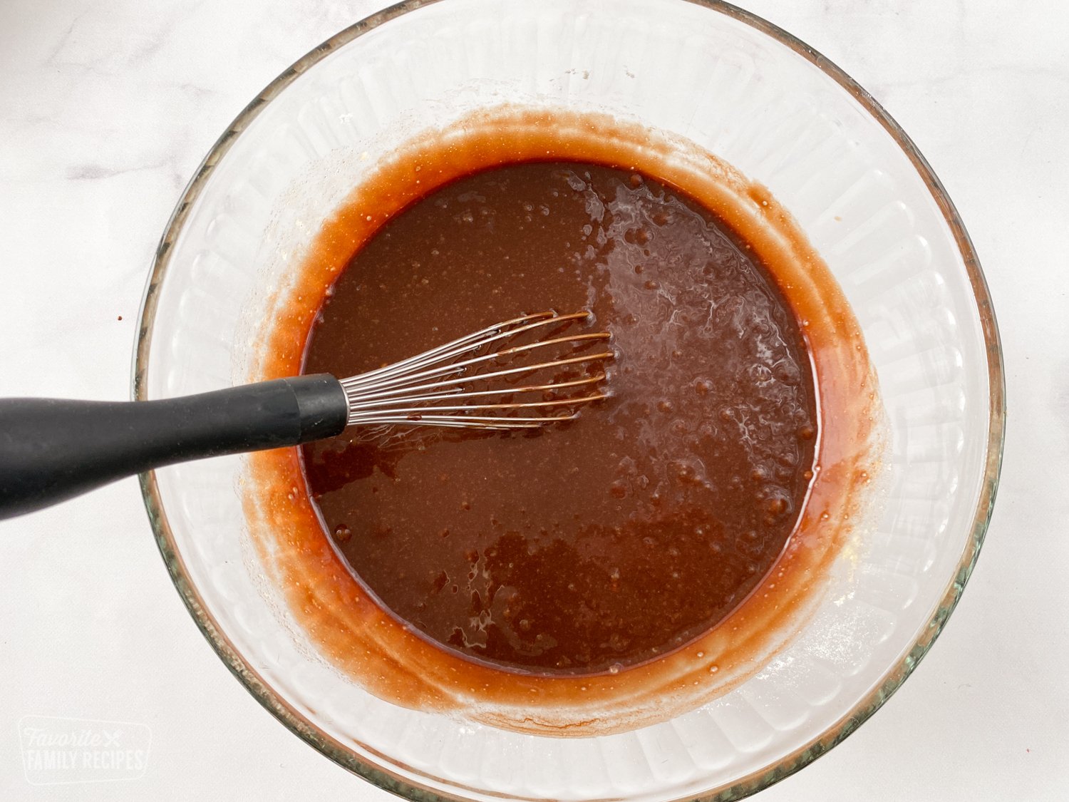 Bowl of melted chocolate and butter to make lava cake