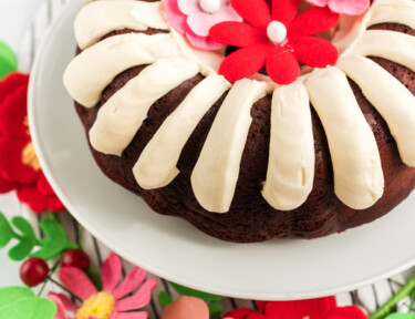 A red velvet bundt cake on a cake stand