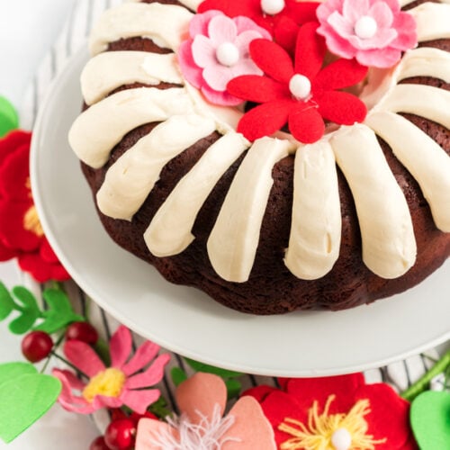 A red velvet bundt cake on a cake stand