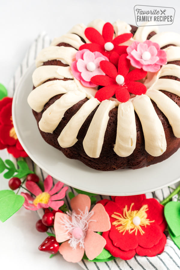 A red velvet bundt cake on a cake stand