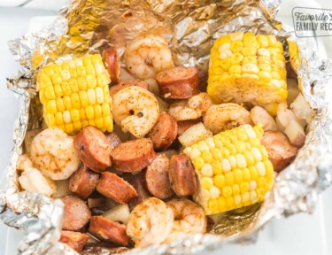 An open Cajun Shrimp Foil Packet on a plate