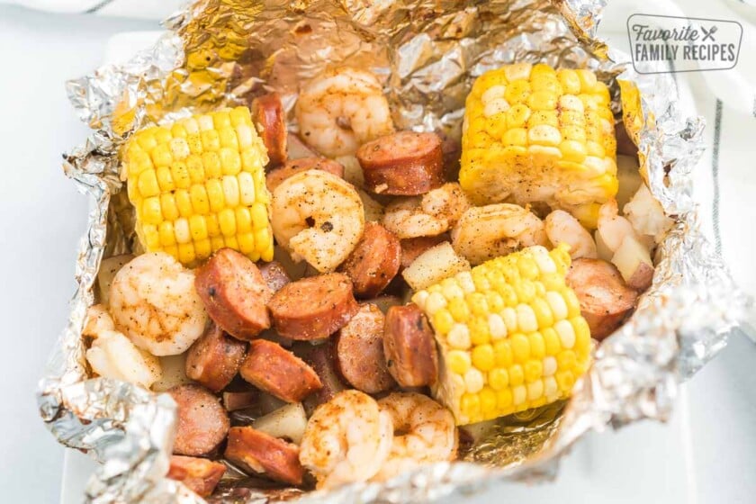 An open Cajun Shrimp Foil Packet on a plate