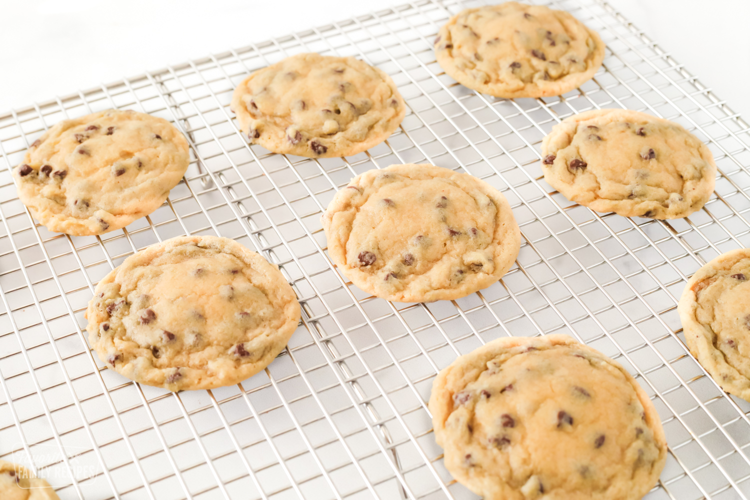 Bakery chocolate chip cookies on a cooling rack