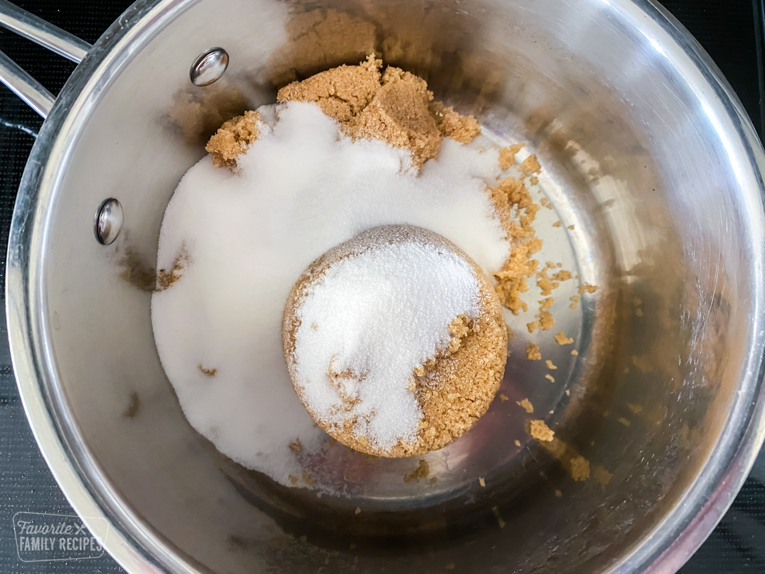 Brown sugar and sugar in a saucepan to make syrup