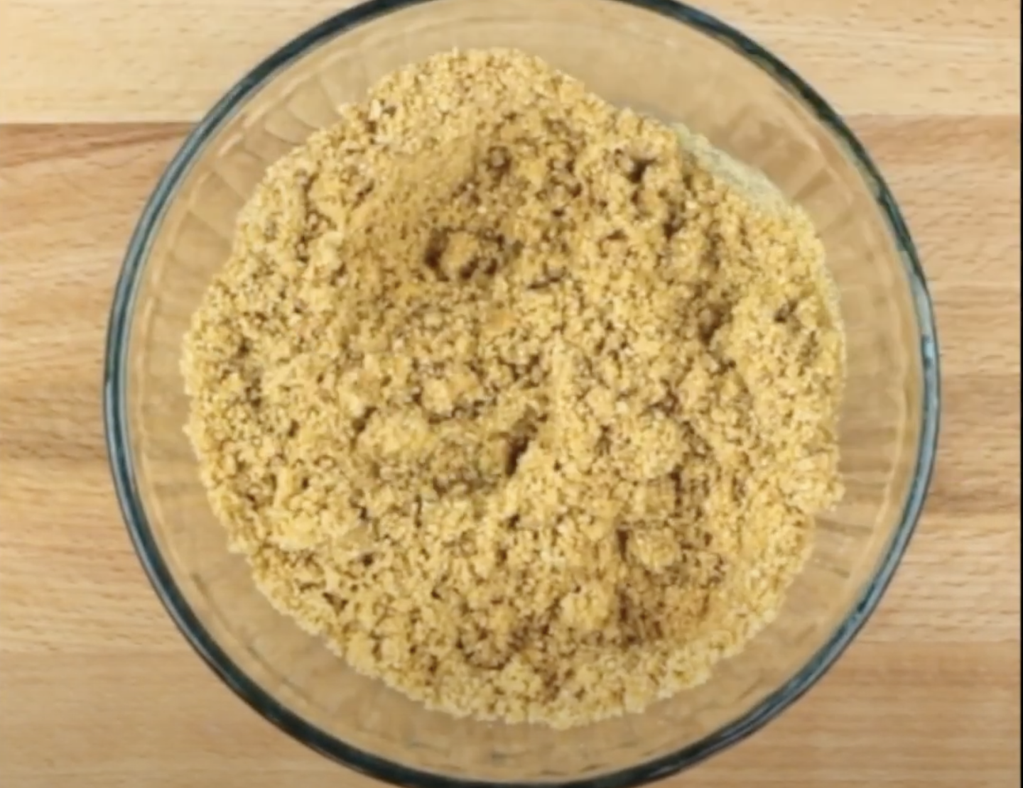 Crushed graham cracker crumbs in a bowl to make crust for Key Lime Pie