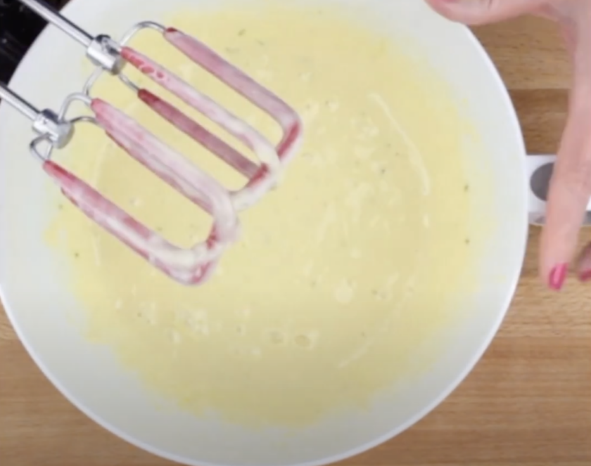 Condensed milk, lime juice, and egg yolks mixed together to make filling for key lime pie