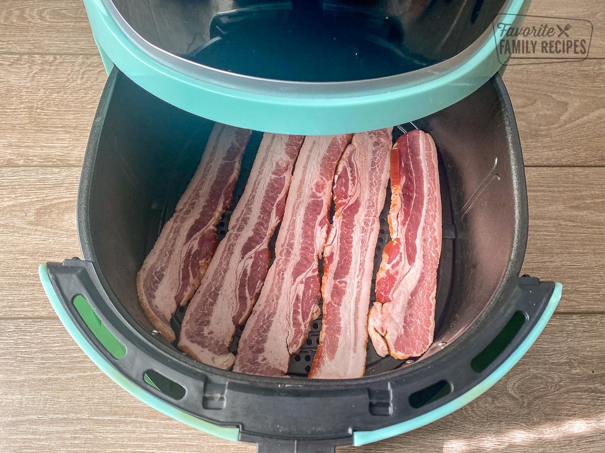 Uncooked bacon in a air fryer.