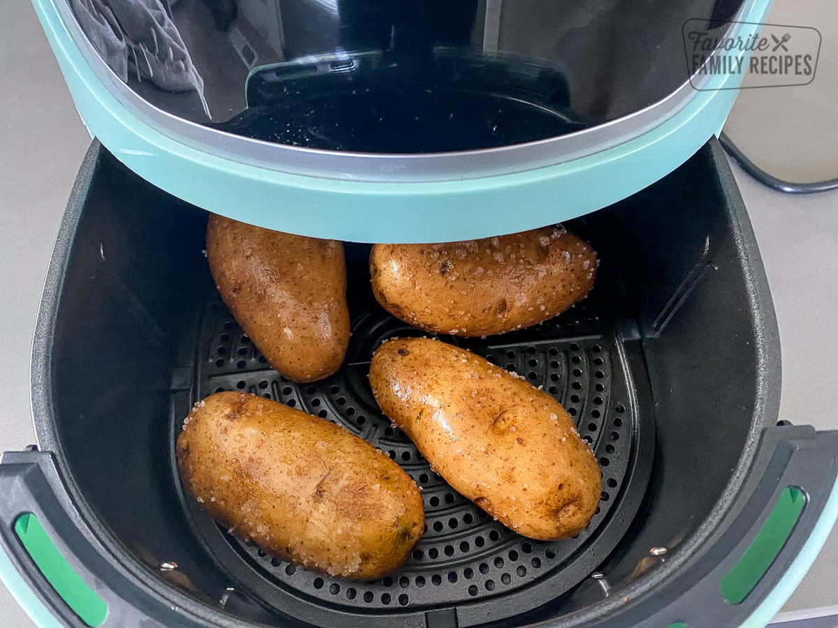 Whole russet potatoes in an air fryer