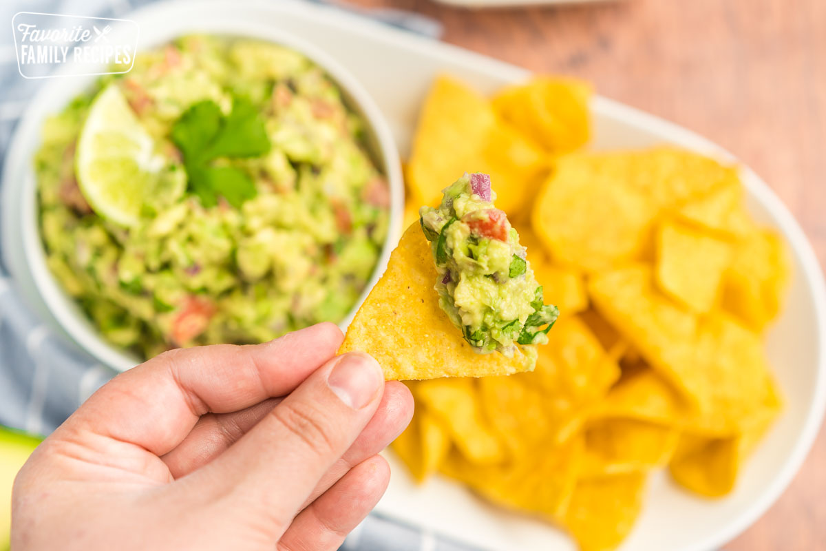 A chip topped with a heap of guacamole