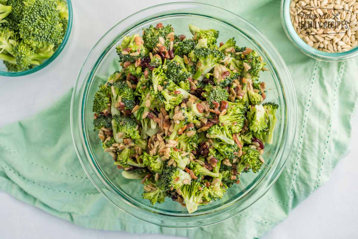 Chopped Broccoli Salad in a serving clear bowl sitting on a green napkin