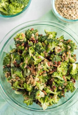 A photo of broccoli salad in a glass bowl.