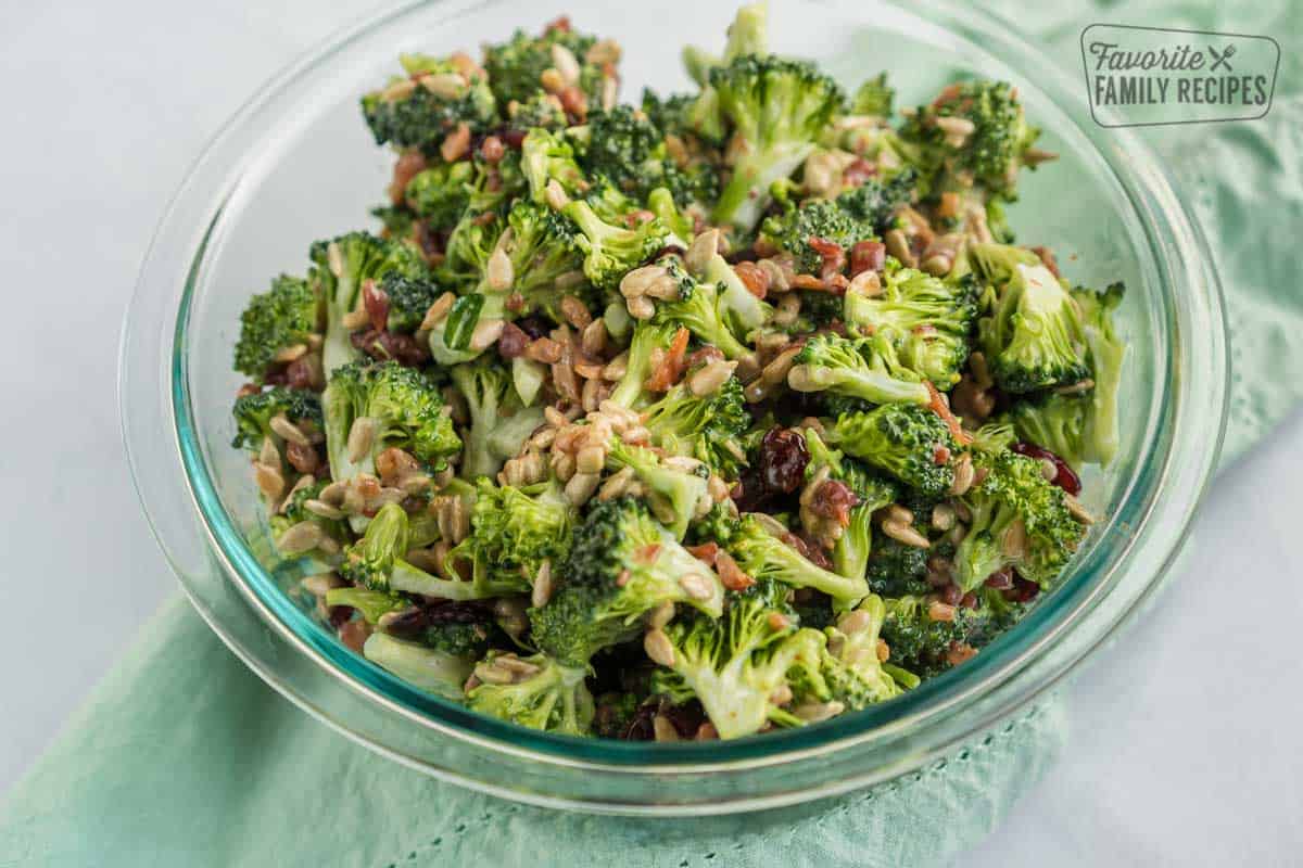 A glass bowl with broccoli salad.