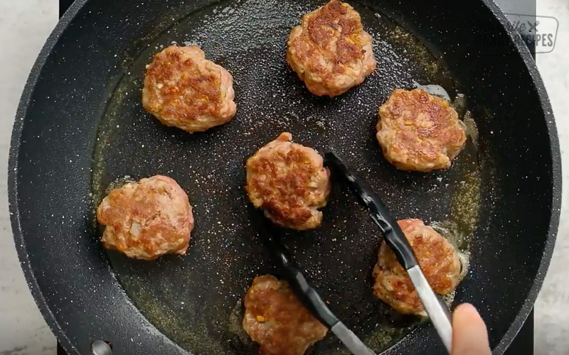 Cooking Danish Meatballs in a skillet