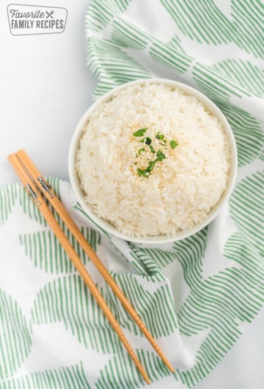 A bowl of rice with chopsticks