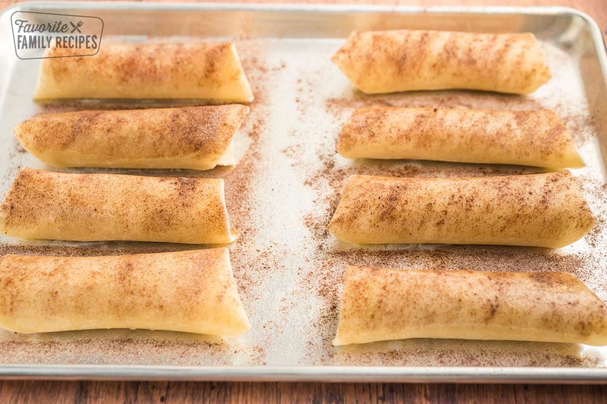 Strawberry empanadas on a baking sheet before they are cooked.