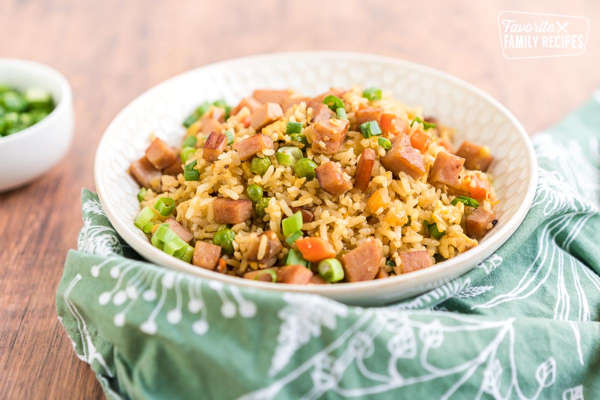 Close up of a bowl of ham fried rice.