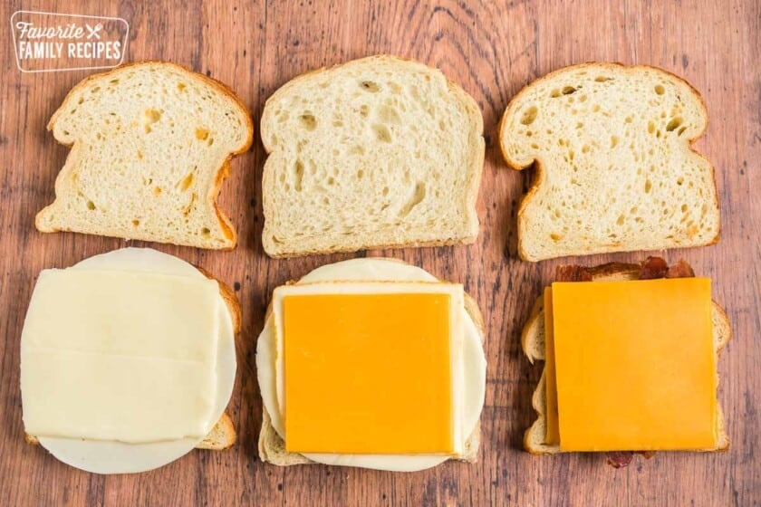 Six slices of bread, three with cheese on them and three plain