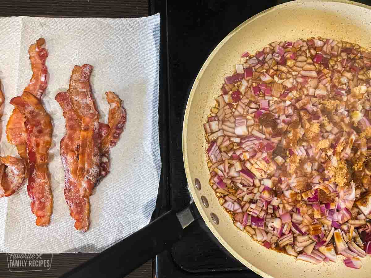 Bacon slices on a paper towel next to a skillet with diced red onions sprinkled with brown sugar
