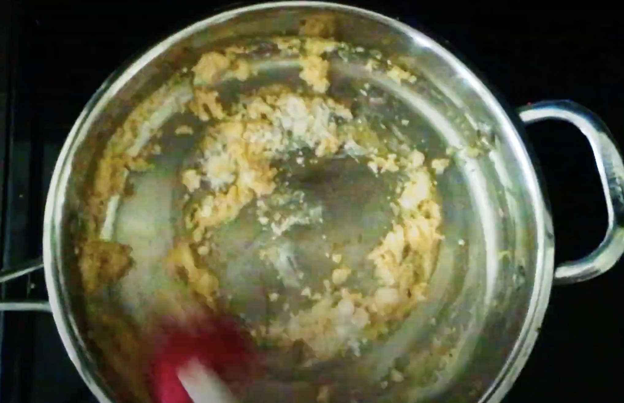 A roux being formed out of melted butter and flour in a skillet