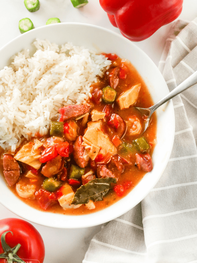 A bowl of Instant Pot Gumbo with white rice on the side