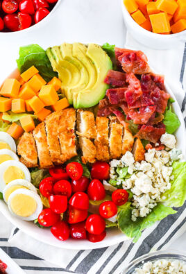 A bowl of salad with Cobb salad toppings.
