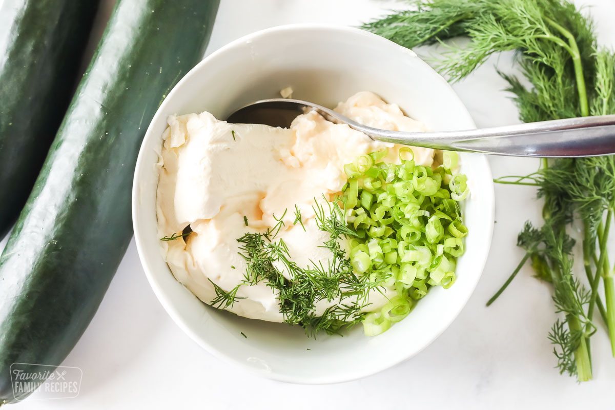 Cream cheese, mayo, green onion, and dill in a small bowl to make a cream cheese spread