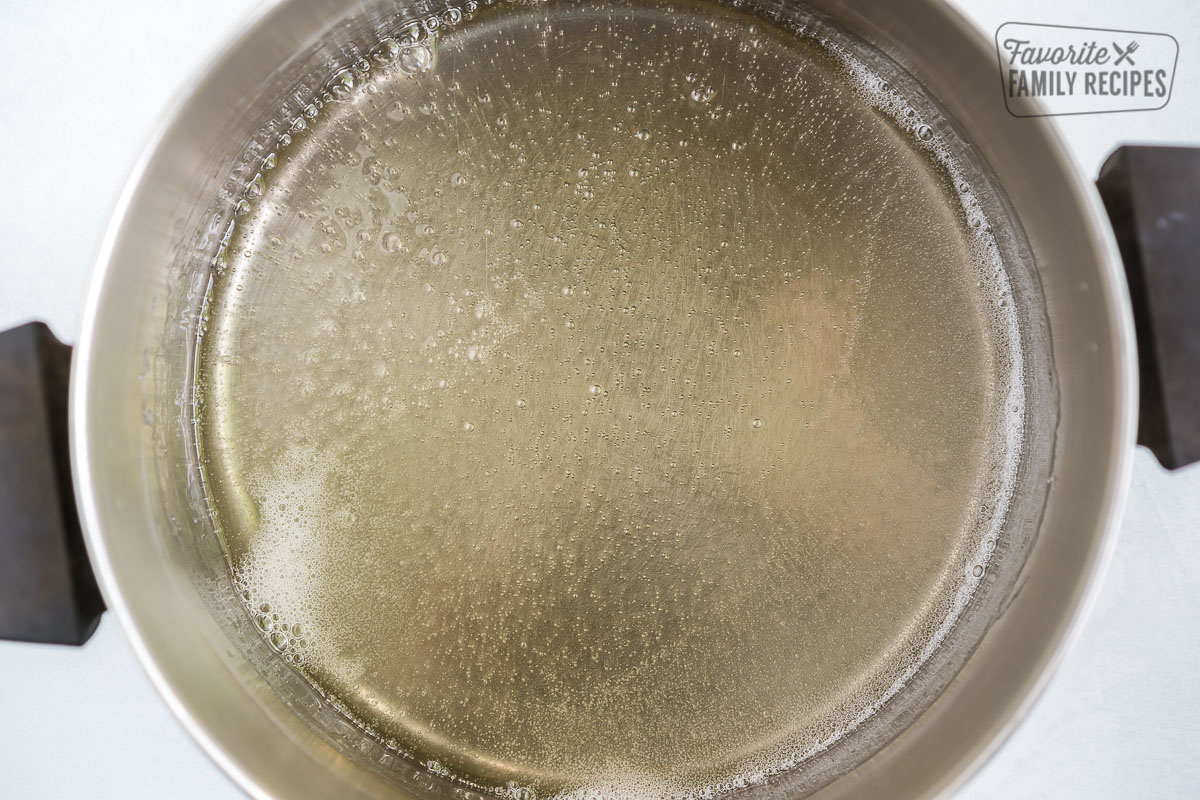 A pot of sugar and Karo syrup boiling on the stove