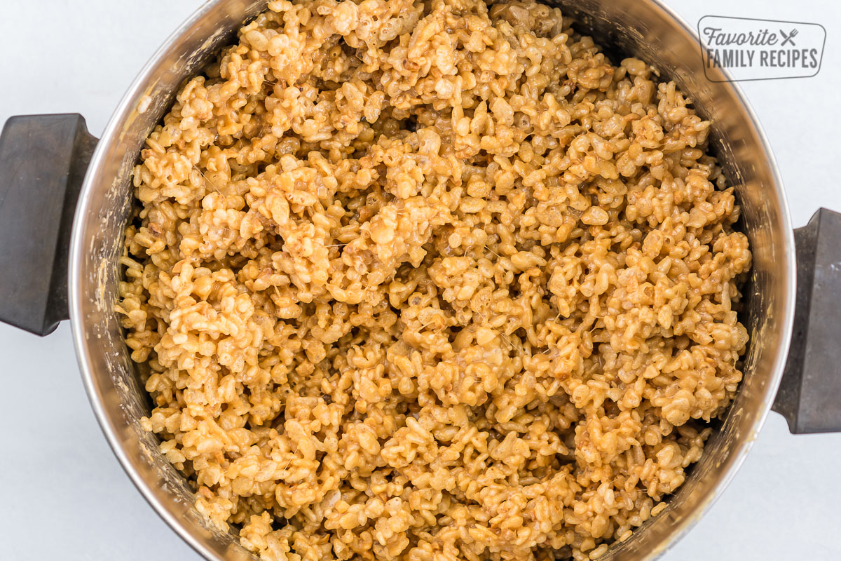 Rice krispies, peanut butter, and syrup mixed in a pot