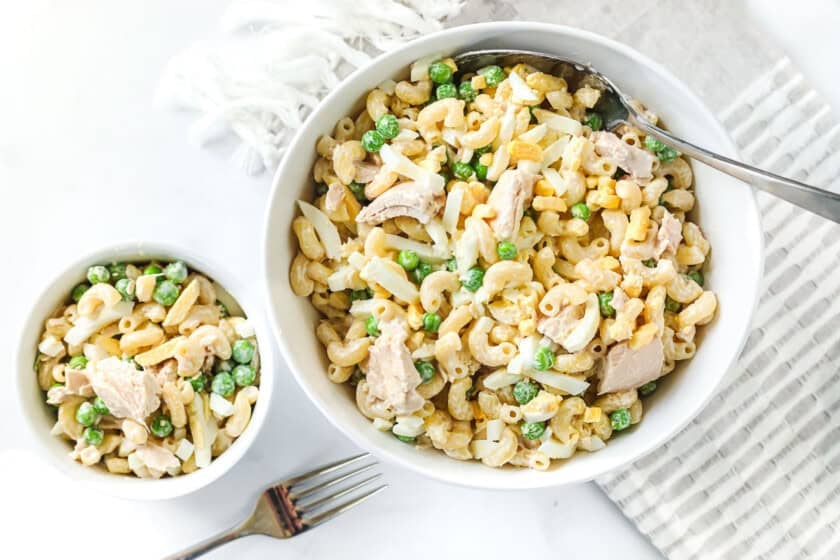 A large bowl and a small bowl of macaroni salad.