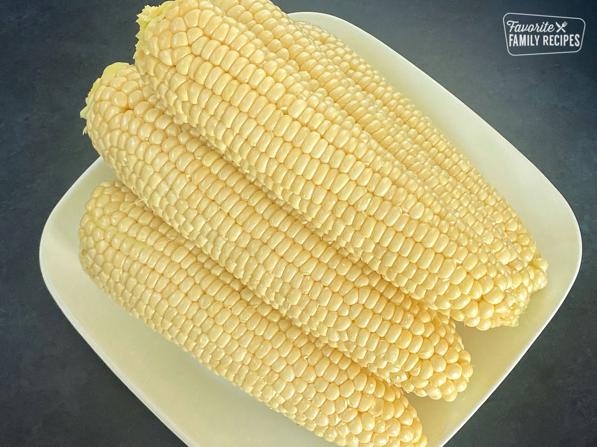 A plate of peeled and washed corn on the cob