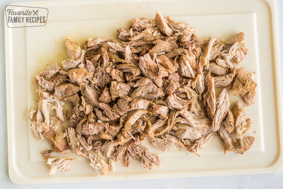 Shredded pork on a cutting board