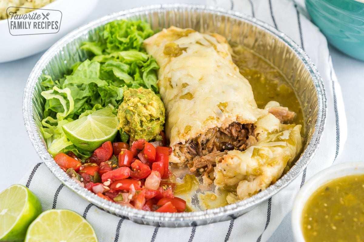 A sweet pork burrito in a metal tin