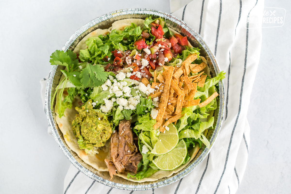 A homemade cafe rio sweet pork salad in a metal tin