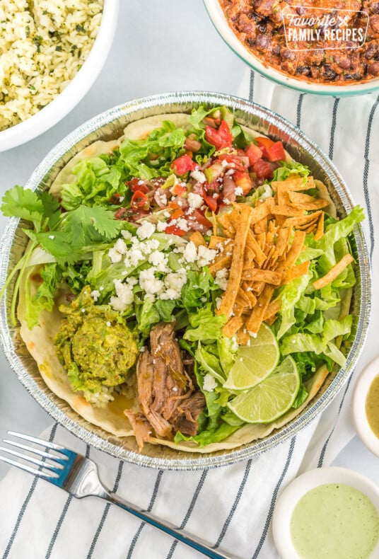 A homemade cafe rio sweet pork salad in a metal tin