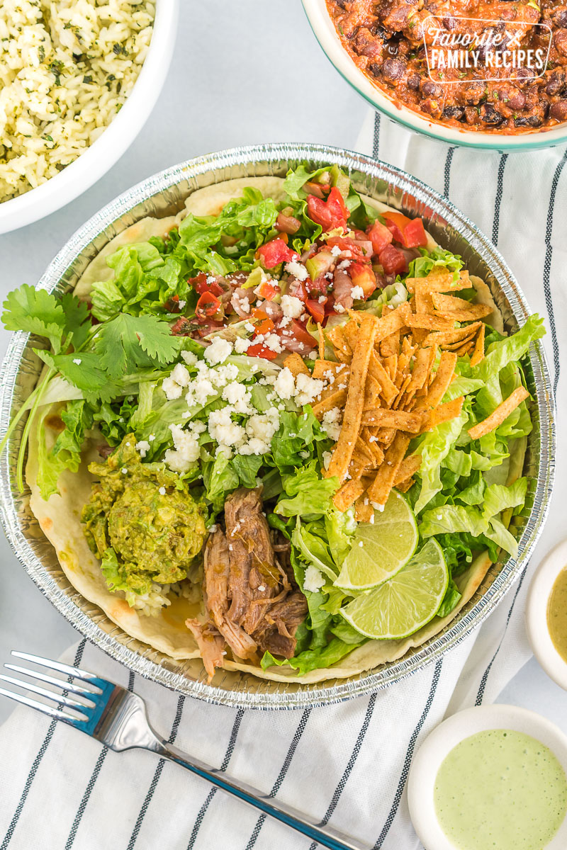 A homemade cafe rio sweet pork salad in a metal tin