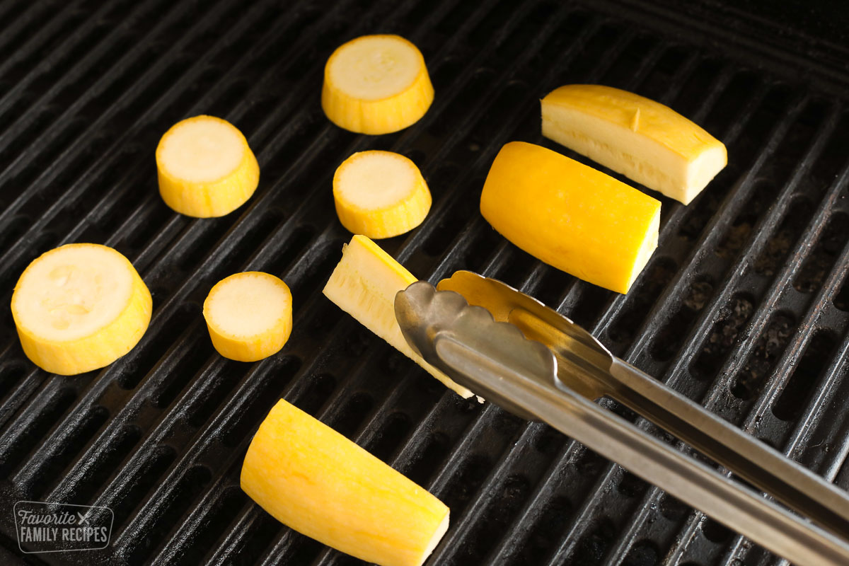Yellow squash being grilled on a grill