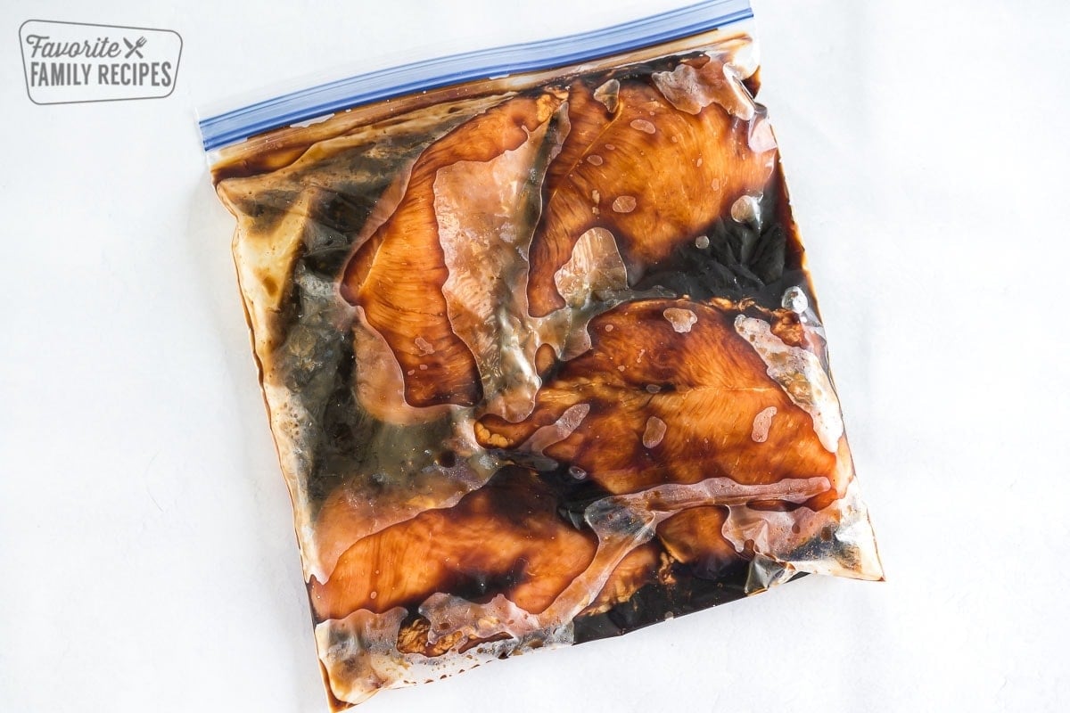 Chicken breasts marinating in teriyaki sauce