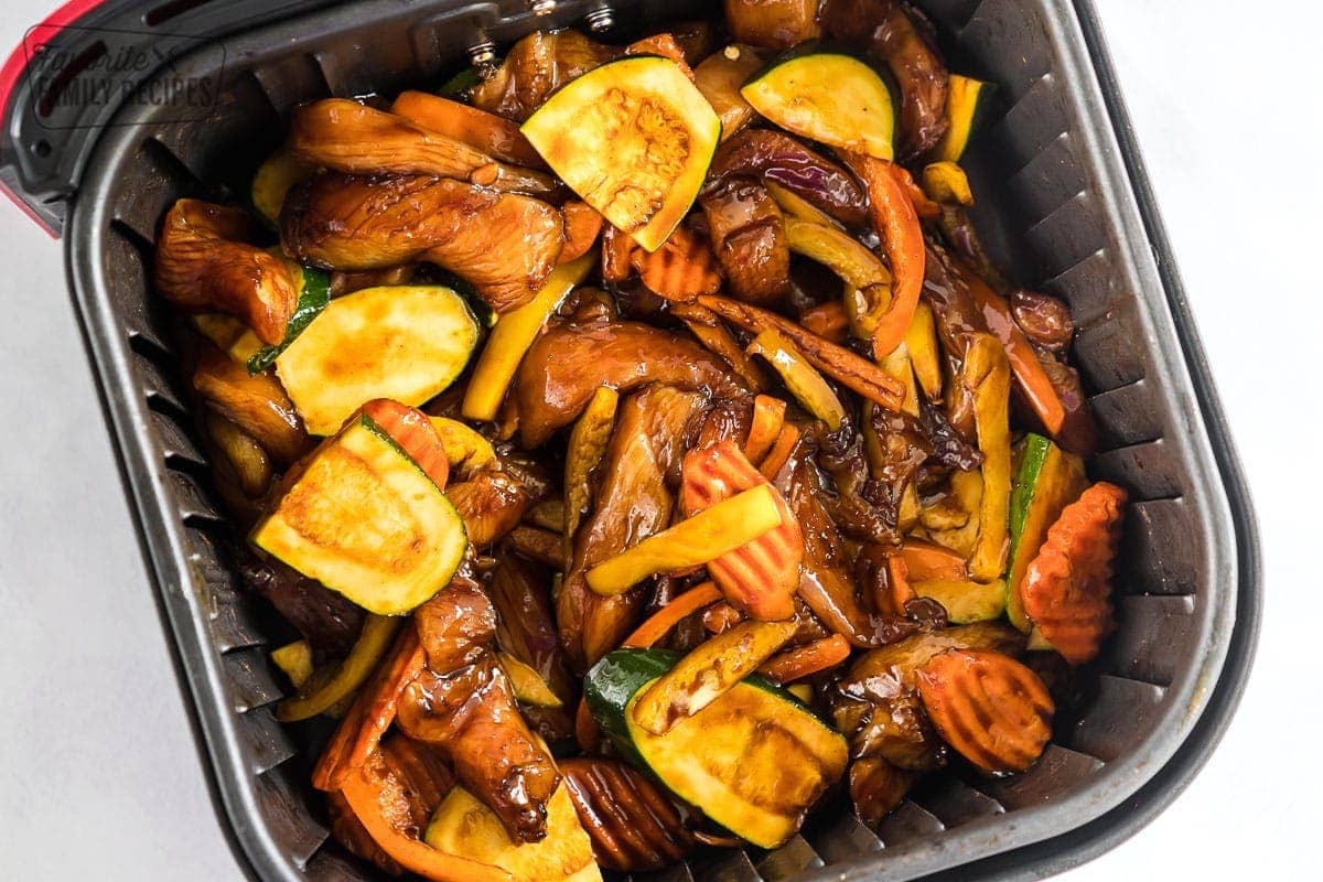 Chicken and vegetables in teriyaki sauce before being cooked