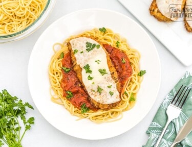 Chicken parmesan on a plate.