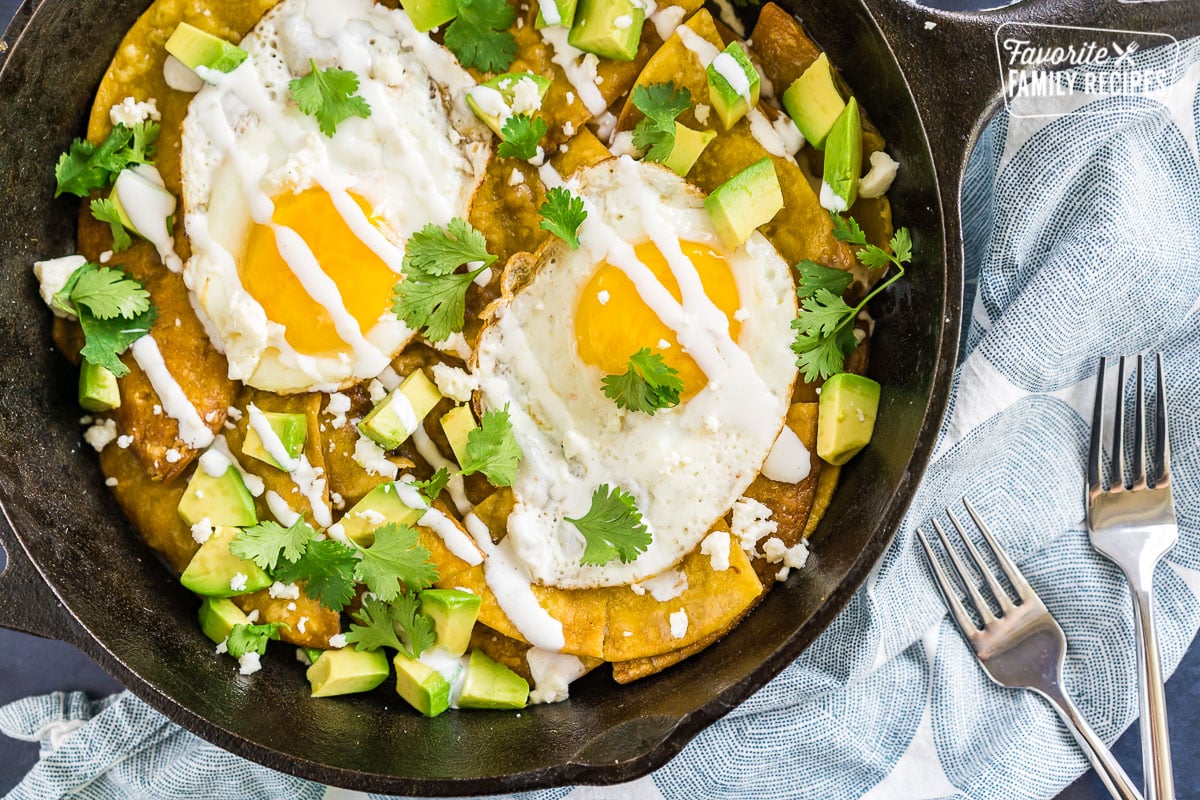 Chilequiles with eggs in a cast iron skillet.