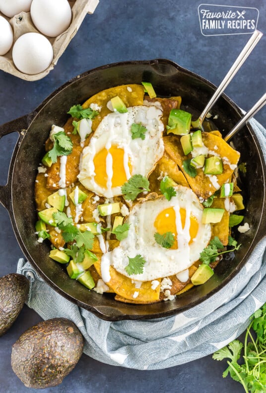 Chilaquiles with eggs in a cast iron skillet.