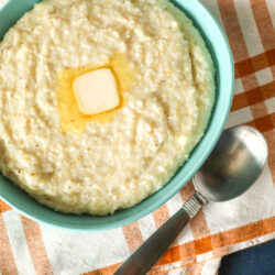 Grits in a bowl with butter melted on top